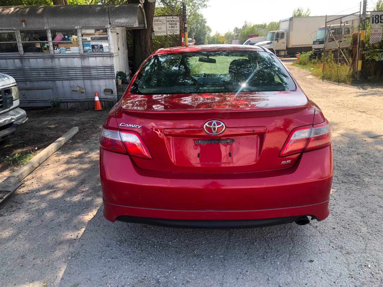 Red 2008 Toyota Camry cabin view